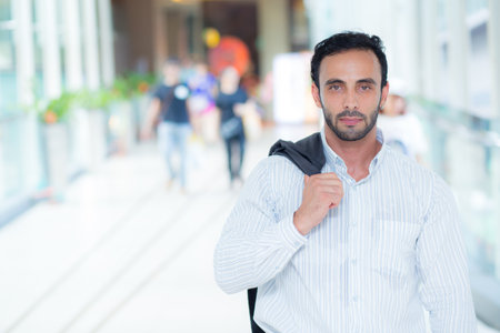 Portrait young caucasian businessman standing with confident at hallway of urban, business man expression, happy guy handsome in formal, entrepreneur or boss with pride and success.の写真素材