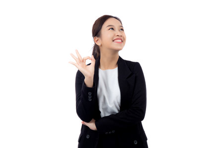 Portrait young asian business woman in suit gesture ok with confident and achievement isolated white background, businesswoman with expression with satisfaction and smile, business concept.の写真素材