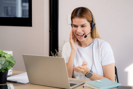 Professional young business woman working and meeting online in modern home office, businesswoman video call with conference distant, call center and support, consulting with business.の写真素材