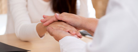 Young asian woman therapy with counseling with senior doctor in modern medical office, therapy and encourage health, doctor consultation with patient with stress and depression.の写真素材