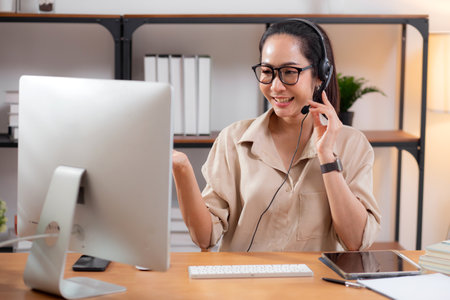 Professional young asian business woman working and meeting online in modern home office, businesswoman video call with conference distant, call center and support, consulting with business.の写真素材