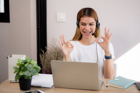 Professional young business woman working and meeting online in modern home office, businesswoman video call with conference distant, call center and support, consulting with business.の写真素材