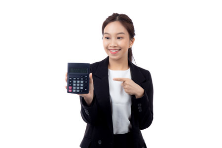 Portrait young asian businesswoman using calculator for calculate expense and budget for saving isolated white background, business woman calculate tax with excited, business and finance concept.の写真素材