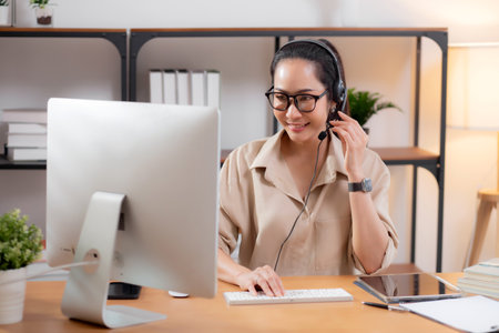Professional young asian business woman working and meeting online in modern home office, businesswoman video call with conference distant, call center and support, consulting with business.の写真素材