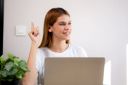 Happy young caucasian businesswoman video call for meeting in modern home office, happiness business woman conference with remote distant on desk, small business and meeting online.の写真素材