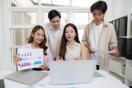 Young asian business team collaboration on project in modern office, group business people working...