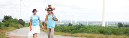 Family with daughter piggyback of father walking on nature, kid and parent relax and leisure together, happy family bond with smiling, travel on vacation in summer together, family concept.の写真素材