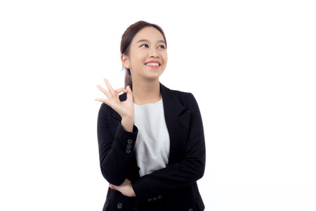 Portrait young asian business woman in suit gesture ok with confident and achievement isolated white background, businesswoman with expression with satisfaction and smile, business concept.の写真素材