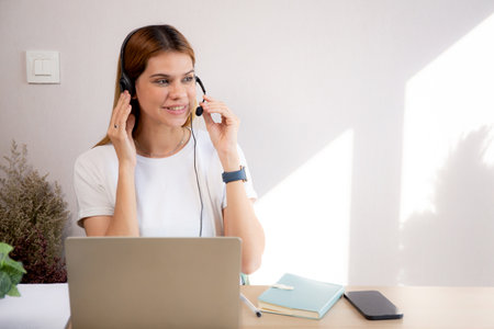 Professional young business woman working and meeting online in modern home office, businesswoman video call with conference distant, call center and support, consulting with business.の写真素材