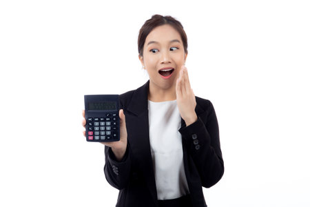 Portrait young asian businesswoman using calculator for calculate expense and budget for saving isolated white background, business woman calculate tax with excited, business and finance concept.の写真素材