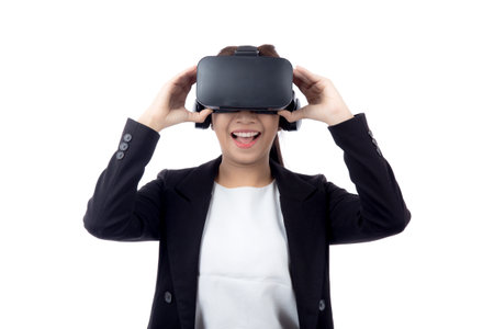 Portrait young asian businesswoman wearing headset virtual reality for device with experience and entertainment with interactive isolated white background, simulation and innovation with business.の写真素材