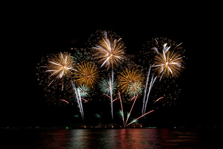 Many flashing colorful fireworks in event amazing with black background celebrate New Year, holiday and festival in night.の写真素材