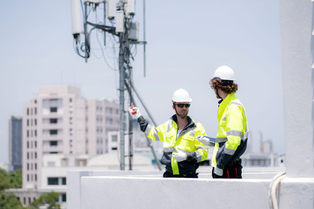 Two technician team talking collaboration working on rooftop building about communication...