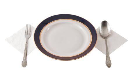 Fork And Spoon Crossed On Plateの写真素材
