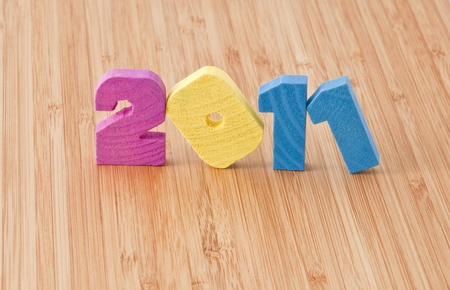 colored wooden figures 2011 on the bamboo surfaceの写真素材