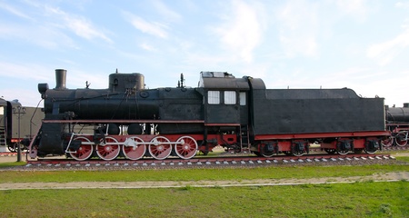 The oldest steam locomotive in the background