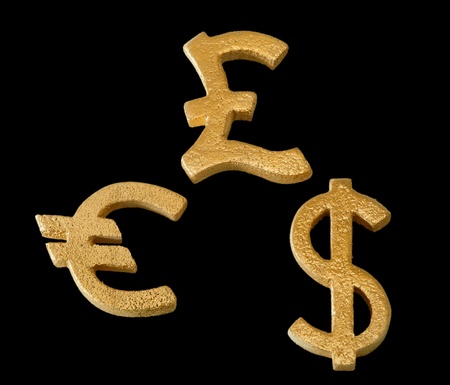 Golden dollar, euro and pound sterling symbol isolated on a black backgroundの写真素材