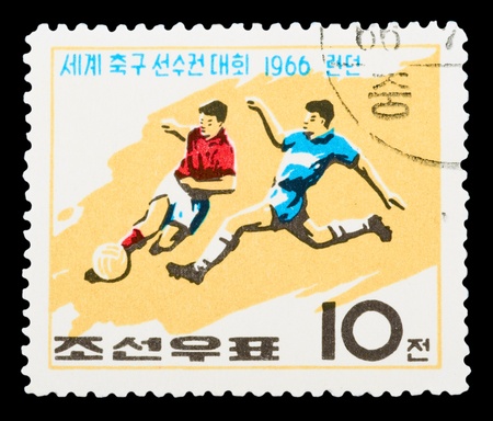 KOREA - CIRCA 1966: A stamp printed in Korea Nord shows football boots, ball and cup with the inscription and name of a series Football World Cup, England, 1966, circa 1966のeditorial素材