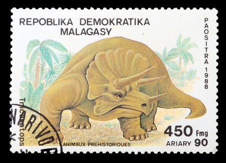 MADAGASCAR - CIRCA 1988: A stamp printed in Madagascar shows animal Triceratops, circa 1988の写真素材