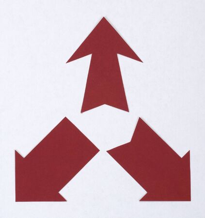 arrows cut from paper isolated on a white backgroundの写真素材