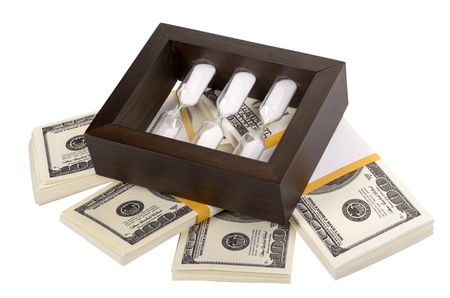 The stack of dollars with an hourglass isolated on a white background