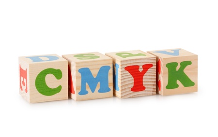 The CMYK word from wooden cubes isolated on a white backgroundの写真素材