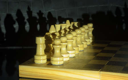 The chess pieces on a chess board