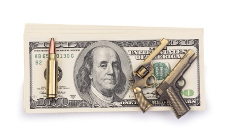 pack of dollars and weapon isolated on a white backgroundの写真素材