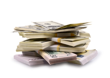 packs of dollars and euro isolated on a white backgroundの写真素材