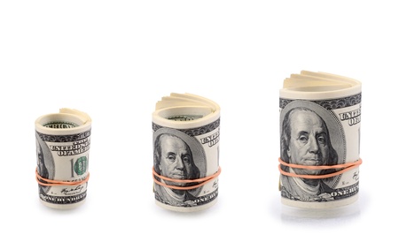 Set of a packs of dollars with a rubber band isolated on a white backgroundの写真素材