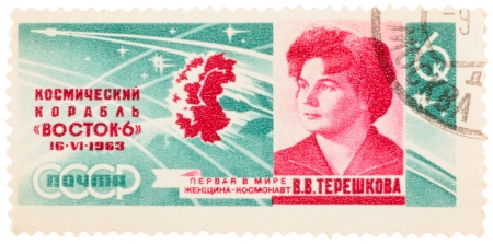 USSR - CIRCA 1963: A stamp printed in the USSR, shows a Tereshkova portrait with inscription First woman cosmonaut, circa 1963のeditorial素材