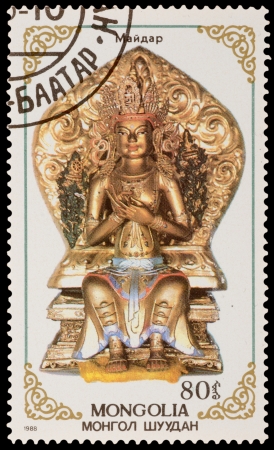 MONGOLIA - CIRCA 1988: A stamp printed in the MONGOLIA, shows statue of Buddhist deities, series, circa 1988のeditorial素材