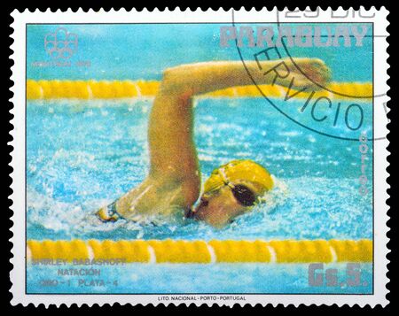 PARAGUAY - CIRCA 1976: a stamp printed in the Paraguay, shows man swimming, series sport games, circa 1976のeditorial素材
