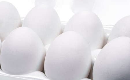 eggs in the package on a white backgroundの写真素材