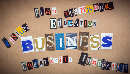 The words in cut out magazine letters pinned to a old paper. Business conceptの写真素材