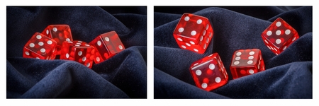 Set of a red dice on a blue velvet backgroundの写真素材