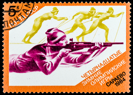 USSR - CIRCA 1984: A stamp printed in USSR shows Winter Games in Sarajevo, biathlon, series sport, circa 1984のeditorial素材