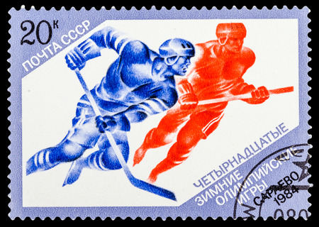 USSR - CIRCA 1984: A stamp printed in USSR shows Winter Games in Sarajevo, hockey, series sport, circa 1984のeditorial素材