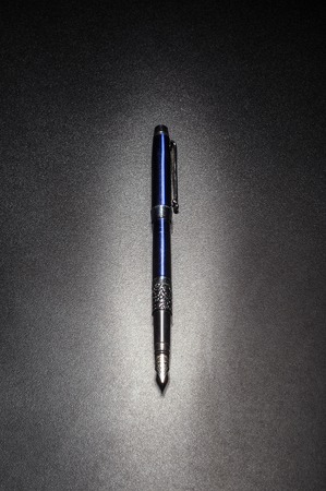 Fountain pen on a black background. Close-up