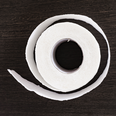 Toilet paper on wood backgroundの写真素材