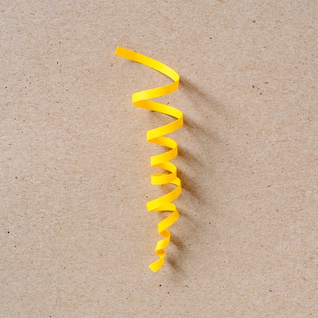 Yellow paper streamer. Carnival party concept