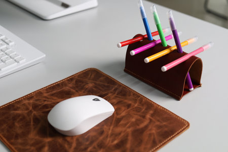 Leather Pen Holder with Colorful Pencils Isolated on Office Desk leather mousepadの写真素材