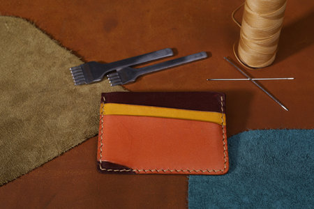 Colorful Leather Card Holder Isolated on Leathers with Leather Crafting Tools