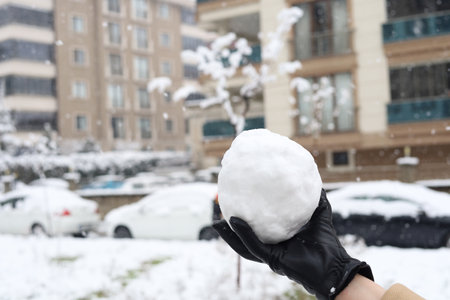 Women holding snowball, winter season photoの写真素材