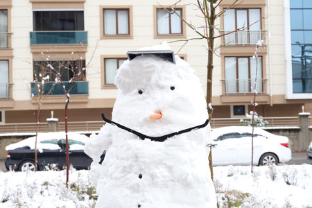 Snowman with hat big smile. Winter Season Background Photo