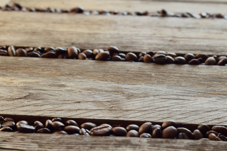 Coffee beans scattered between the slats.の写真素材