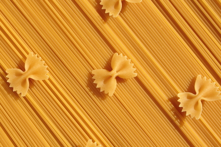 Pasta bows placed on spaghetti.の写真素材