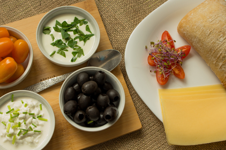 Vegetarian food with fresh tomatoes, olives and cheese.の写真素材