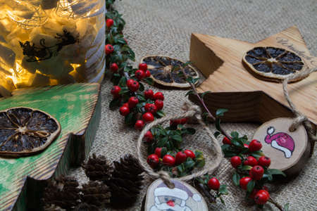 Hand-decorated Christmas decorations in a composition with live twigs.の写真素材