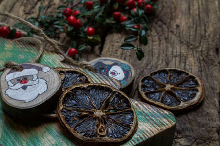 Hand-decorated Christmas decorations in a composition with live twigs.の写真素材